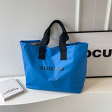 Weiyinxing And Winter Candy Color Nylon Bag Female Large Capacity Short Trip Handbag Bag Versatile One Shoulder Commuter Tote Bag